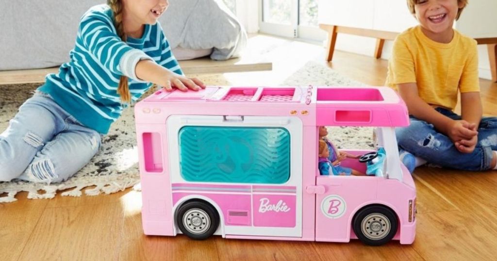 kids playing with Barbie RV