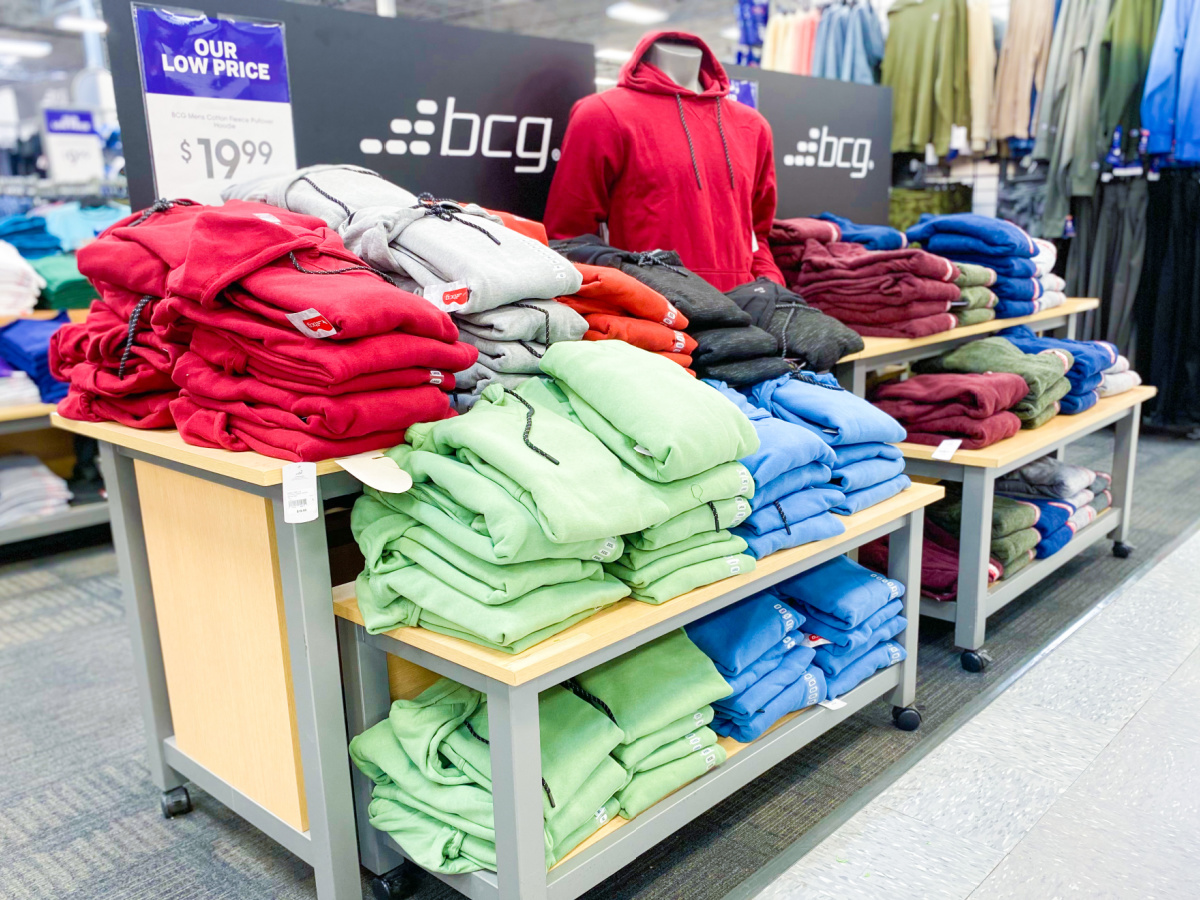 table display in store with fleece clothing on it