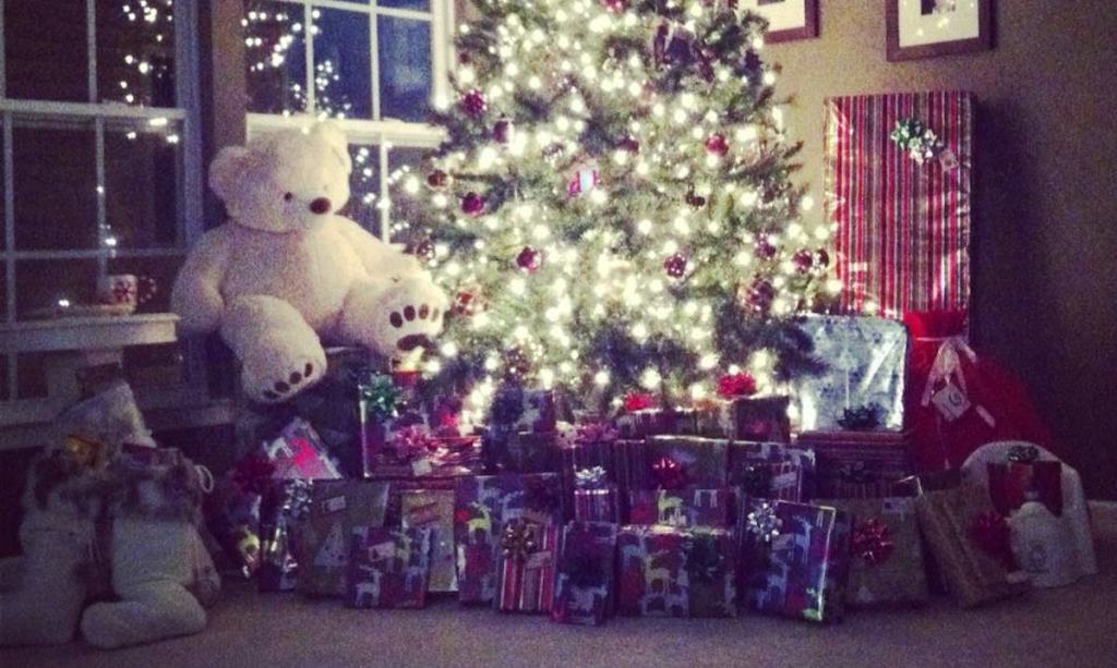christmas tree with presents and big teddy bear