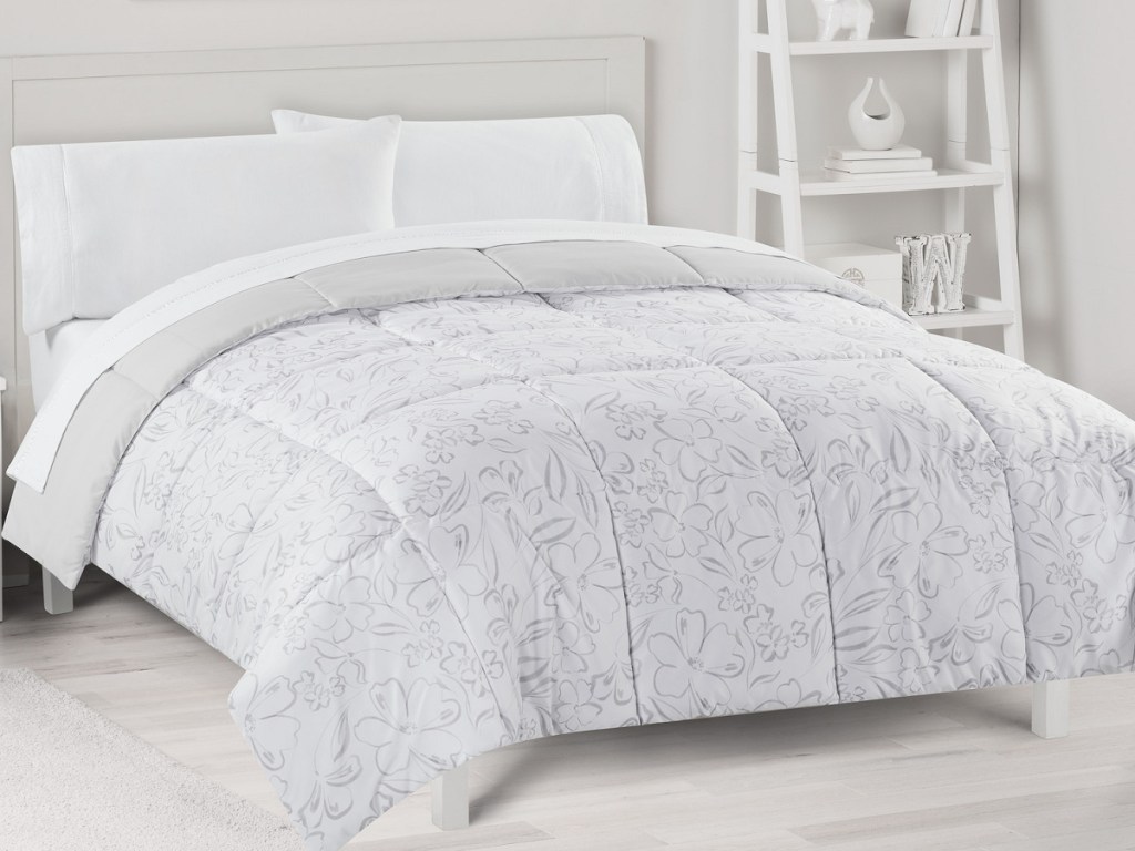 comforter on bed displayed in bedroom