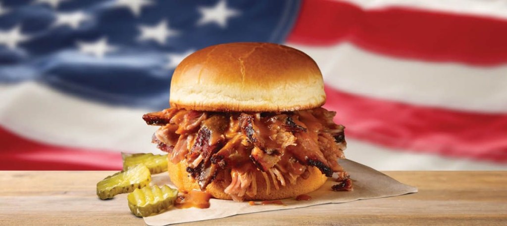 pulled pork sandwich in front of American flag