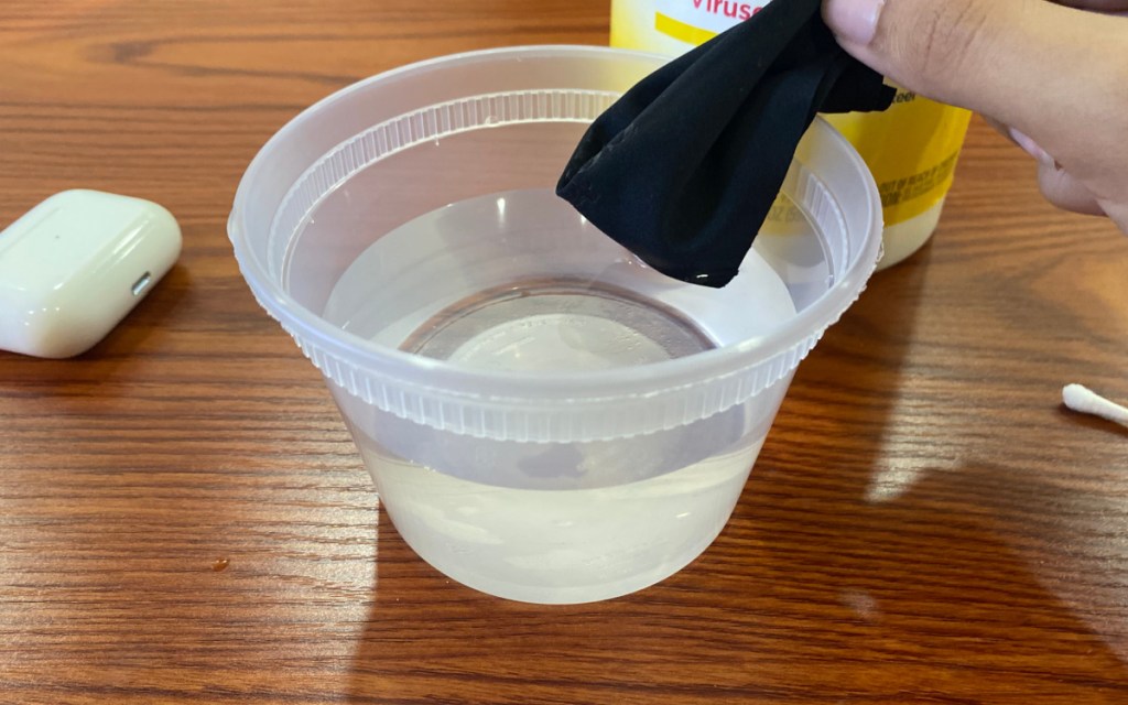 dipping lint free cloth in water