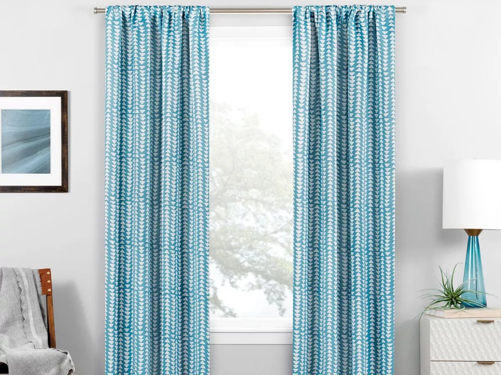 blue and white print curtains in living room