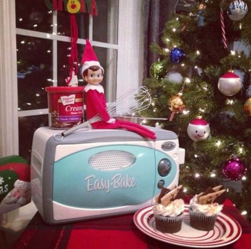 elf on the shelf with easy bake oven and cupcakes