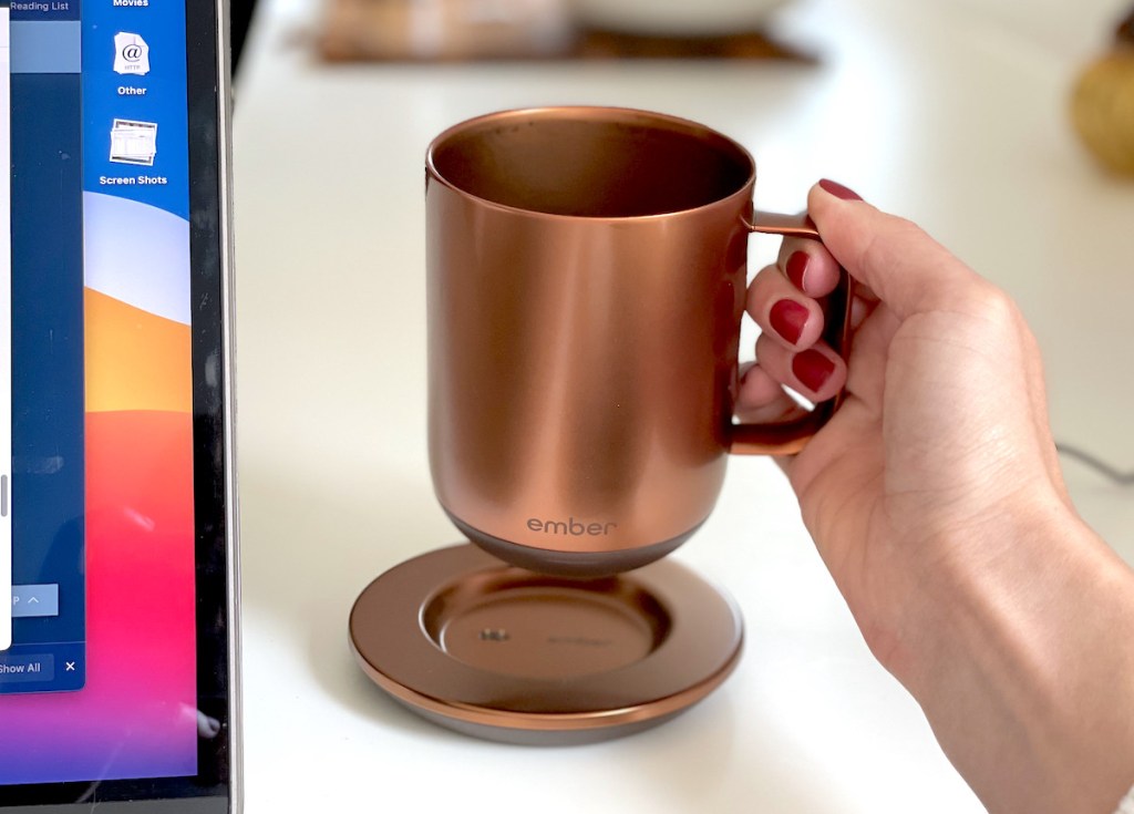 hand holding copper ember temperature controlled mug
