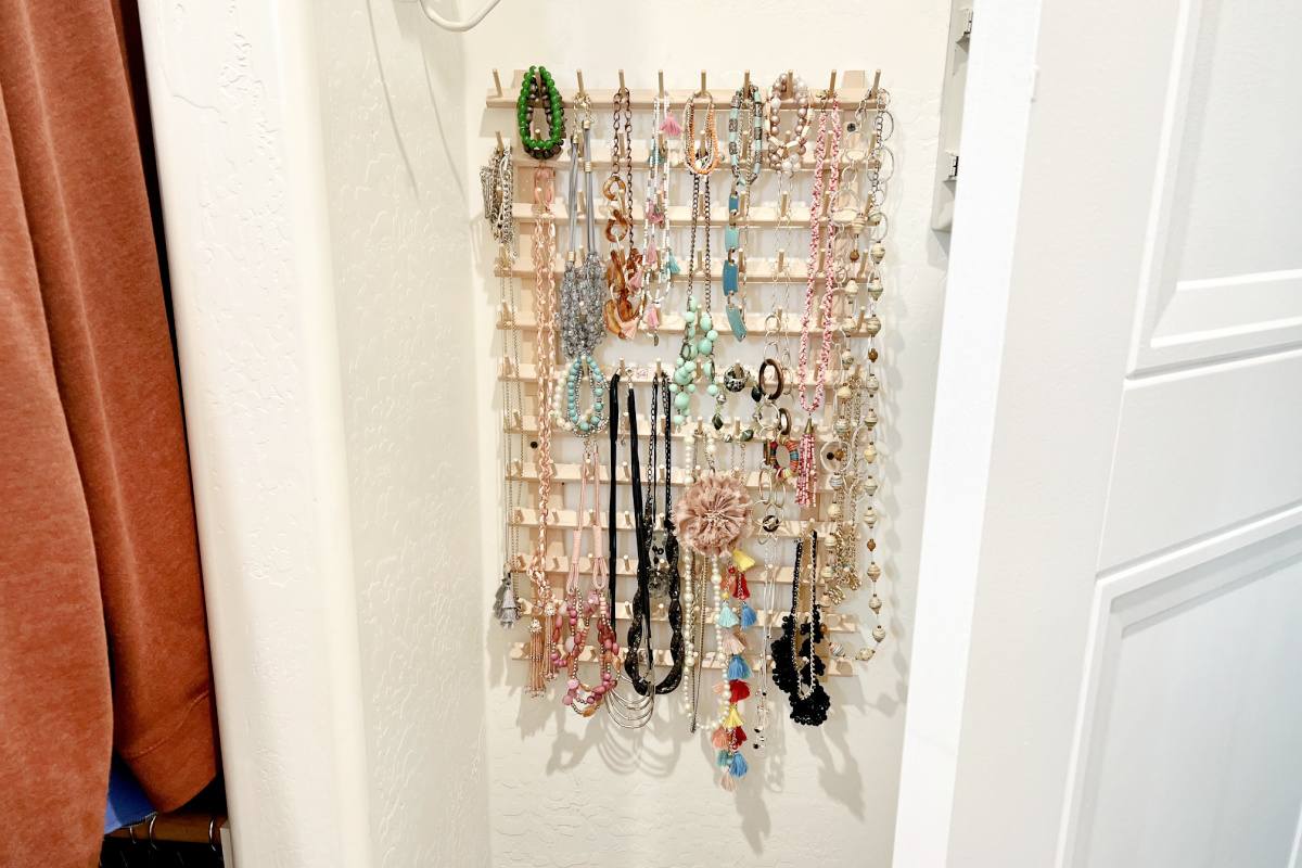 hanging two thread racks behind the door in closet