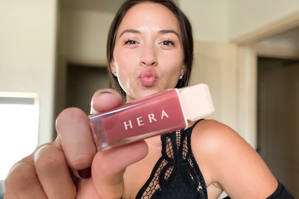 hera lip tint nude in womans hand