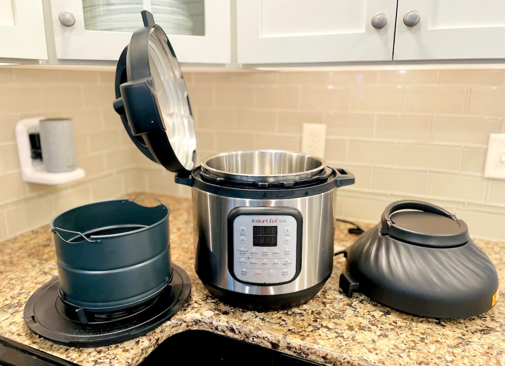 instant pot air fryer with lid and accessories sitting on kitchen countertop