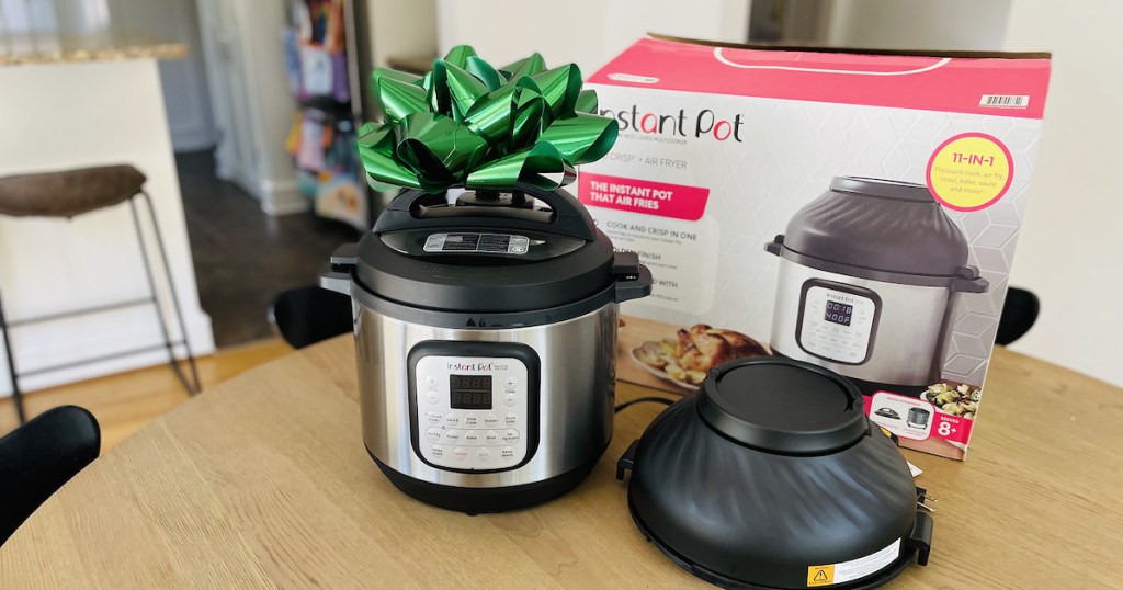 stainless steel instant pot air fryer with big green bow on top