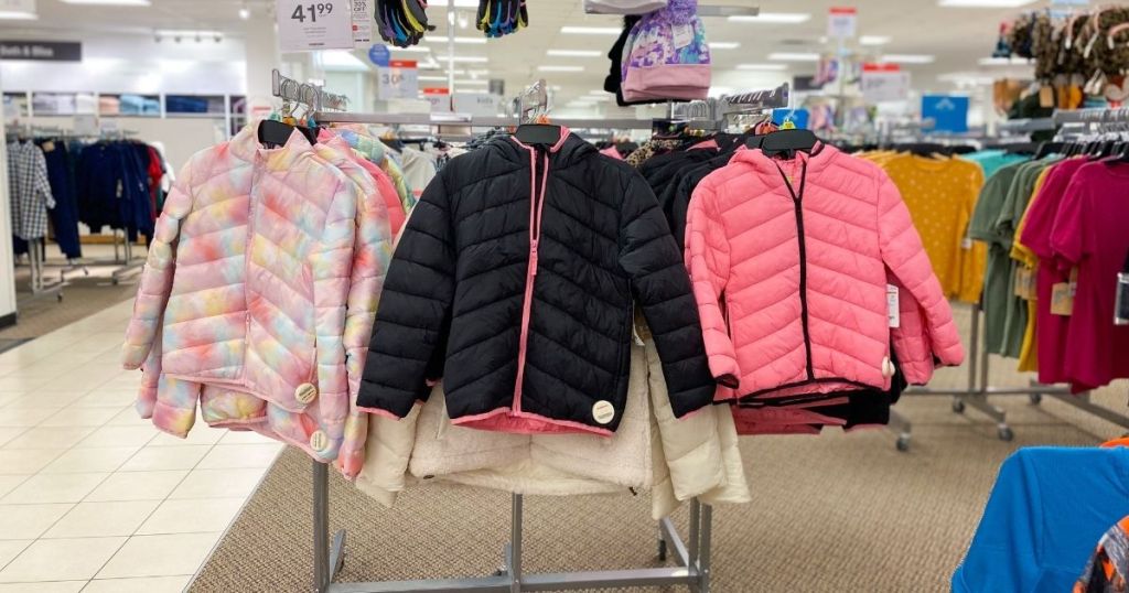 kids puffer jackets hanging in store