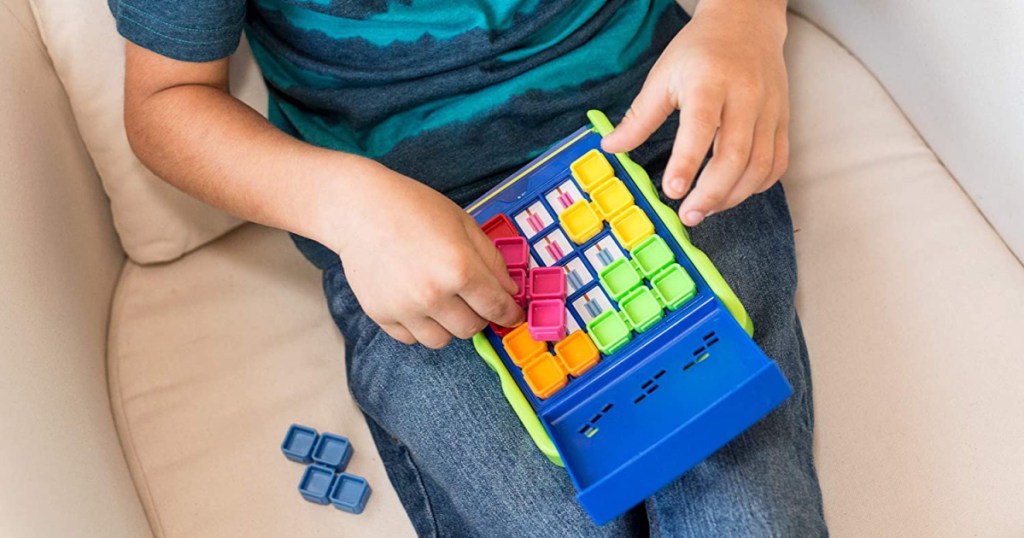 boy playing with a puzzle game