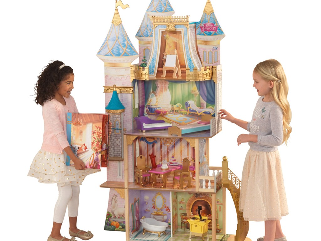 two girls playing with princess castle