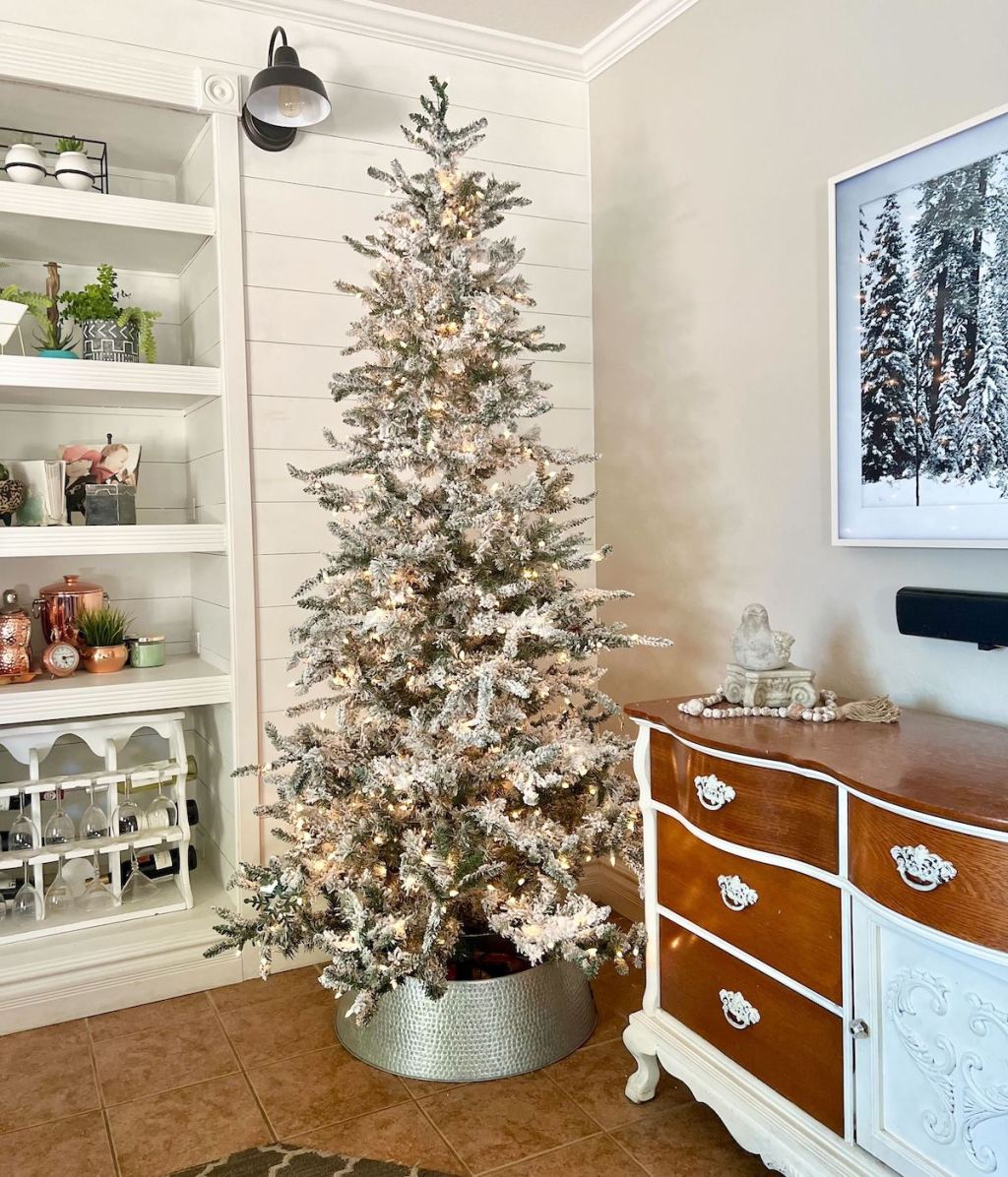 pre lit christmas tree on display in corner of living room