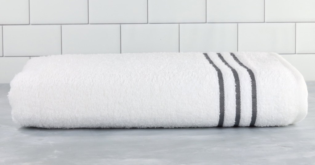 white bath towel with gray stripes