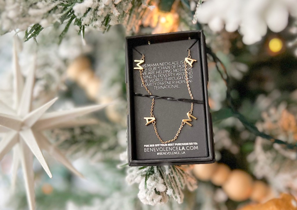 mama necklace in box sitting on christmas tree - last minute christmas gifts
