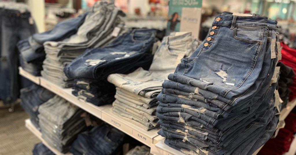 stacks of folded maurices jeans at the store