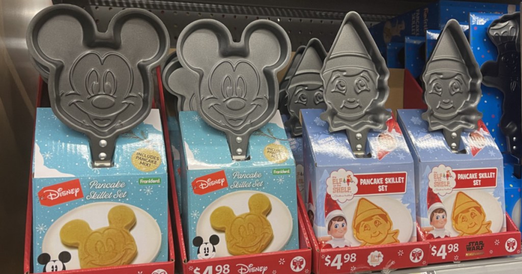 store shelf with small skillets in the shape of characters
