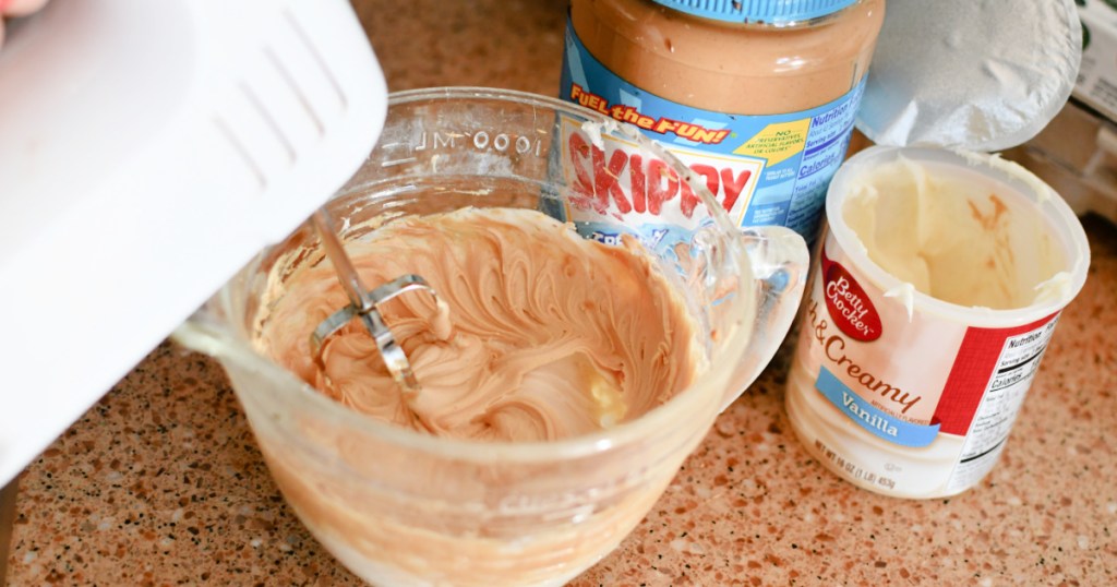 mixing two ingredient peanut butter glaze