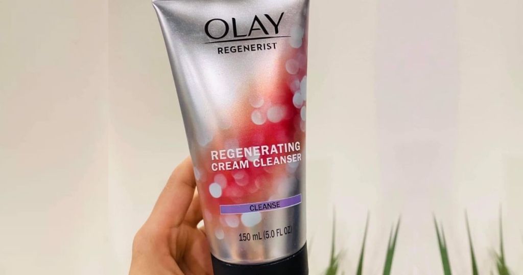 holding olay cleanser