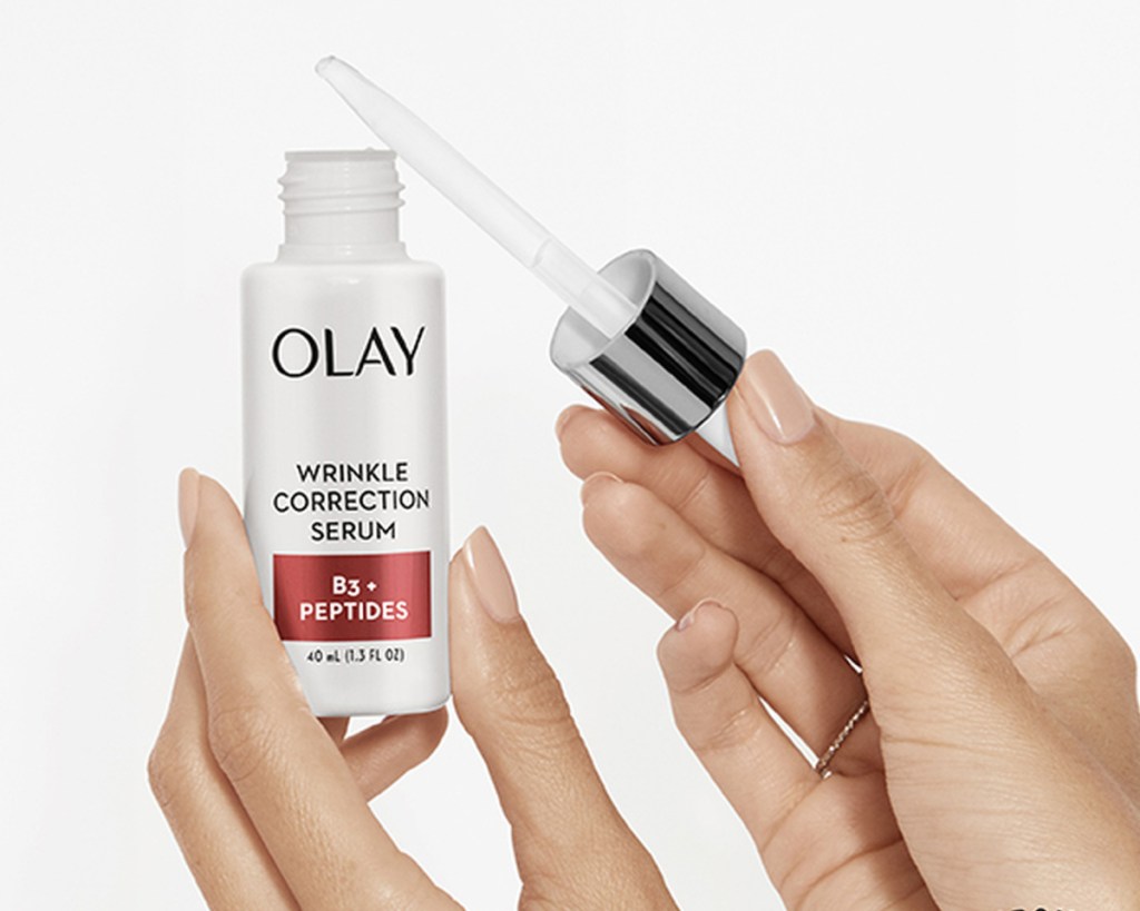 olay wrinkle correction serum in hands