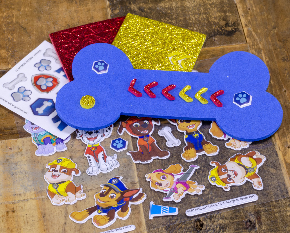 paw patrol art and craft supplies displayed on a table