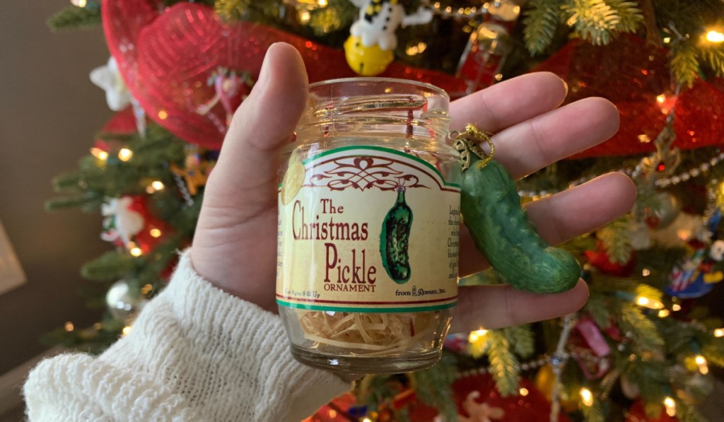 pickle and jar ornament in hand
