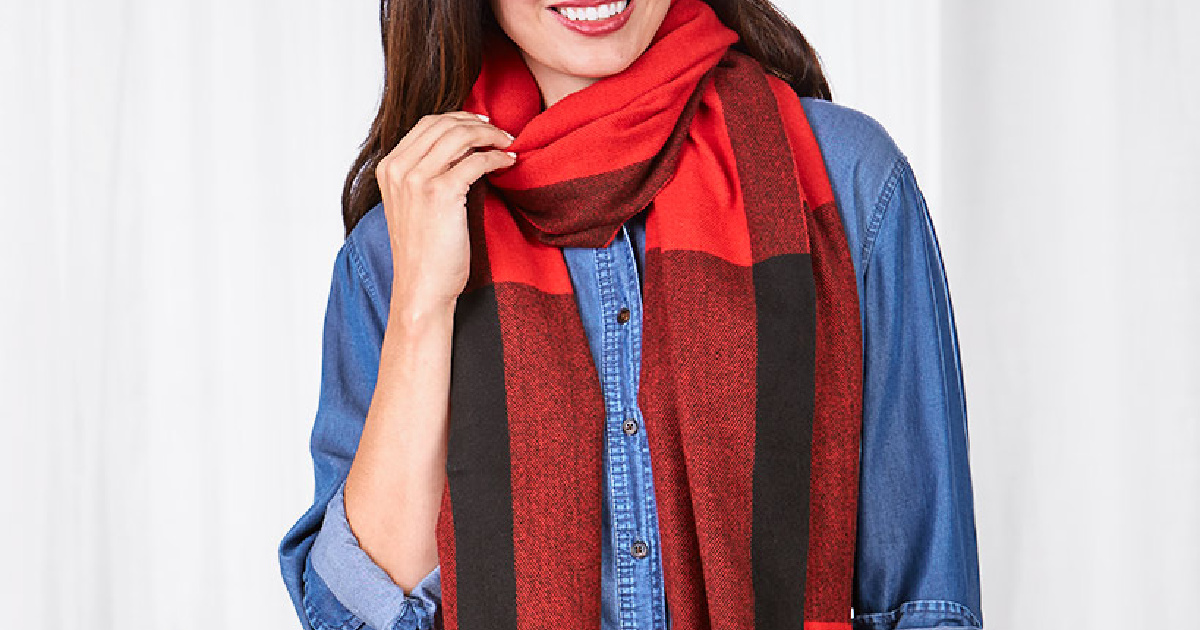 woman wearing a blue denim shirt and red and black plaid scarf