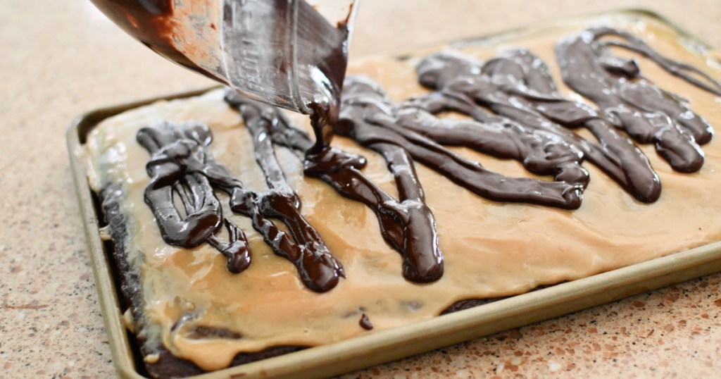 pouring chocolate glaze on a cake
