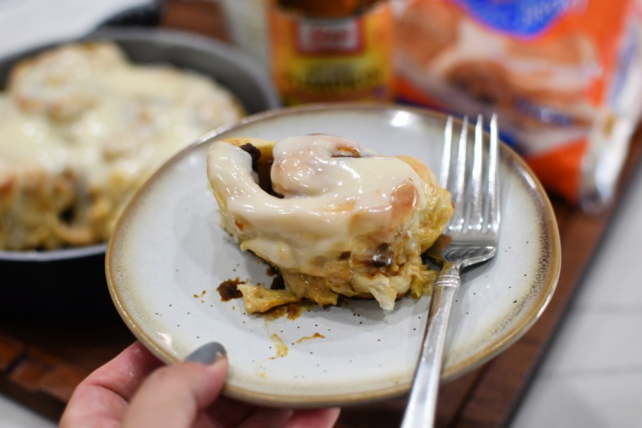 pumpkin spice cinnamon roll on a plate