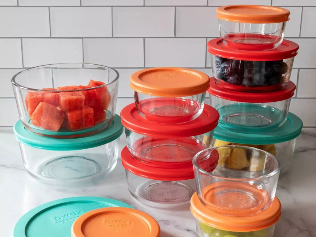 glass containers with plastic lids in assorted colors and sizes