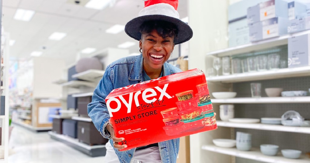 woman holding a red pyrex storage set box