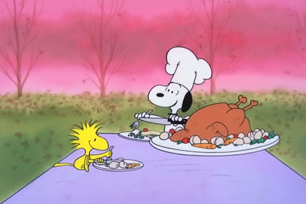 Snoopy from A Charlie Brown Thanksgiving at a table
