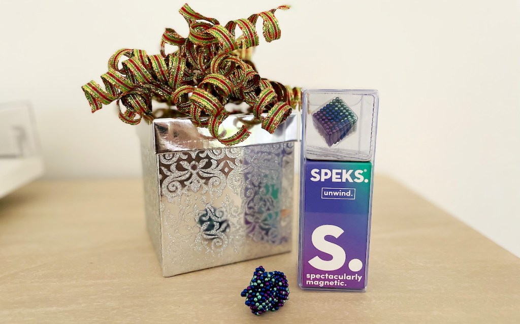 box of speks with holiday box and bow