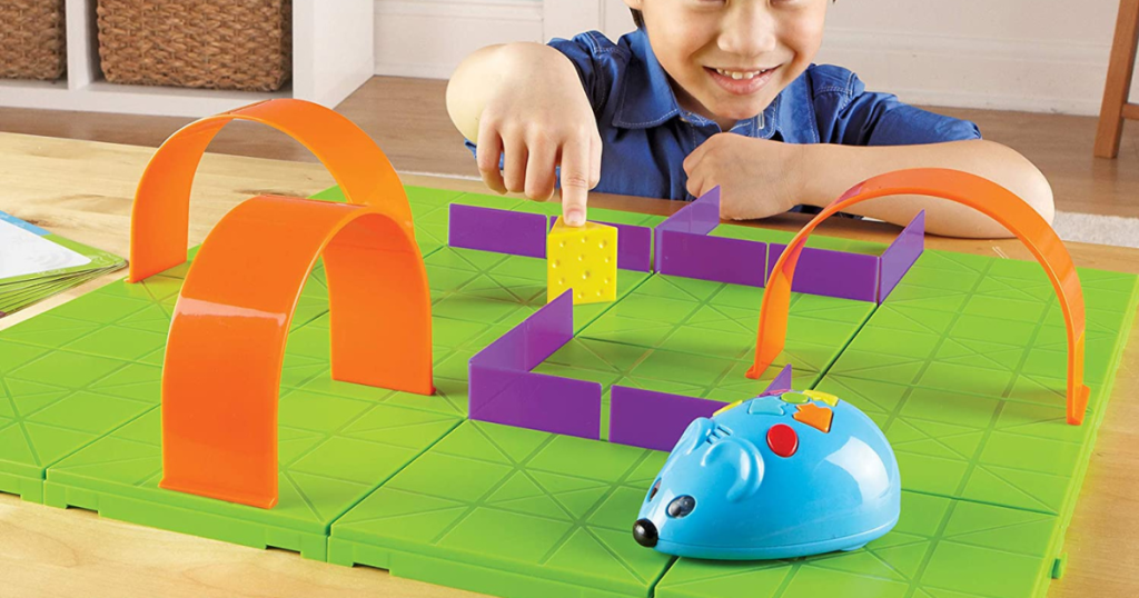 boy playing with mouse stem toy activity