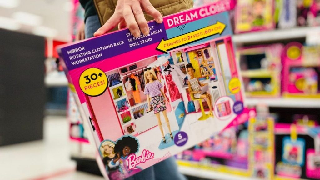 man carrying Barbie Dream Closet