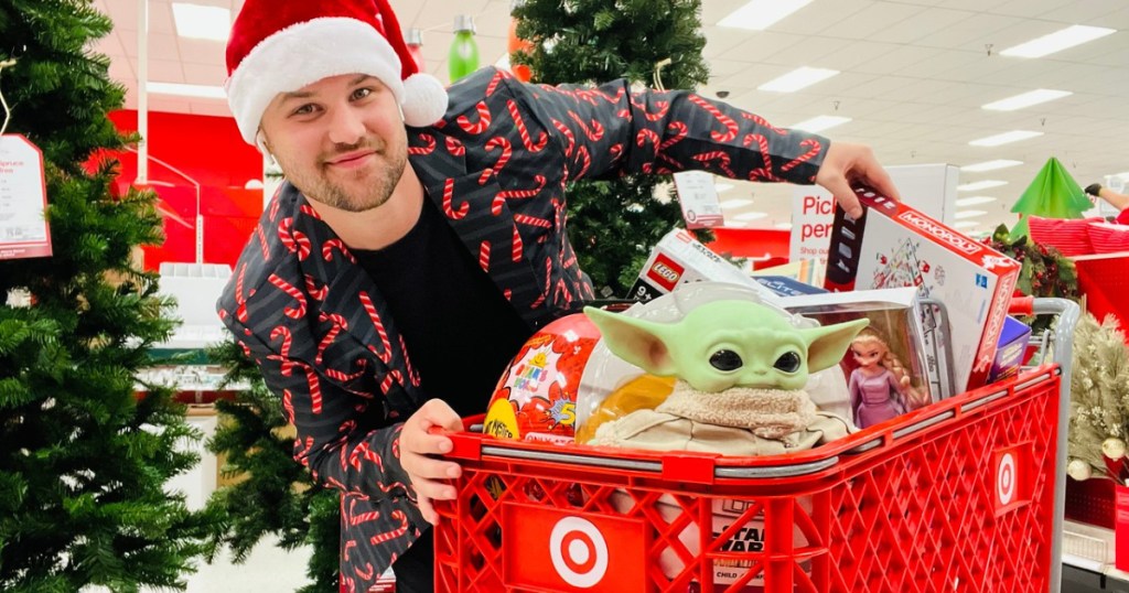 man with a target cart full of toys