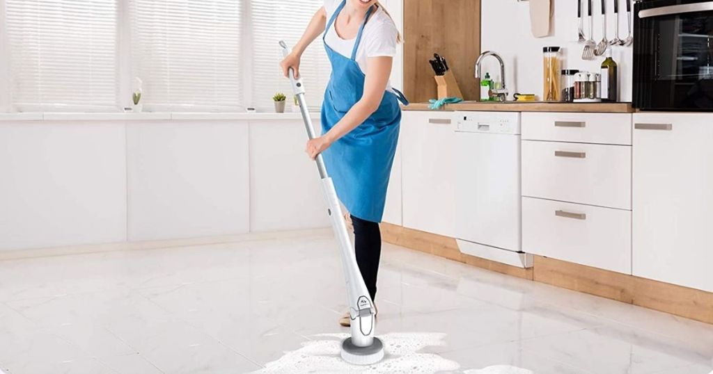 woman using scrubber to clean floors