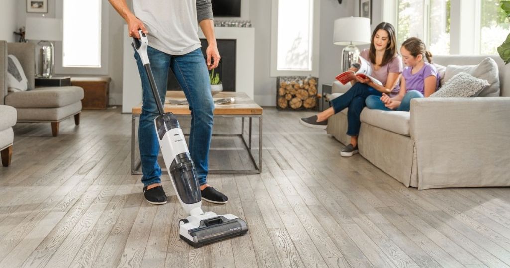 Tineco Cordless Vacuum cleaner in living room with family