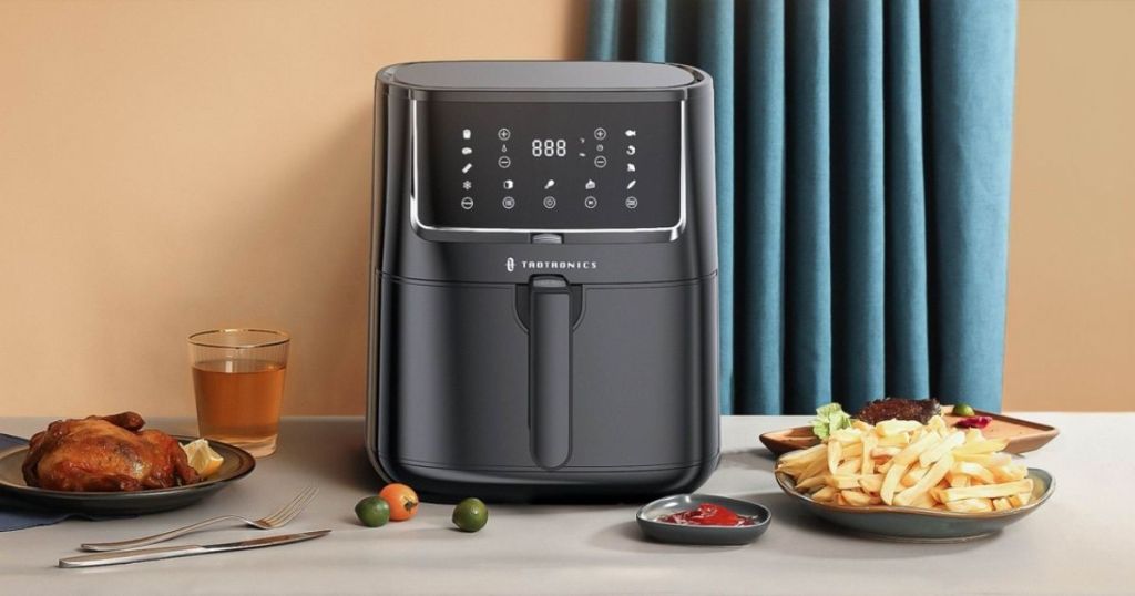 air fryer with fried foods surrounding it
