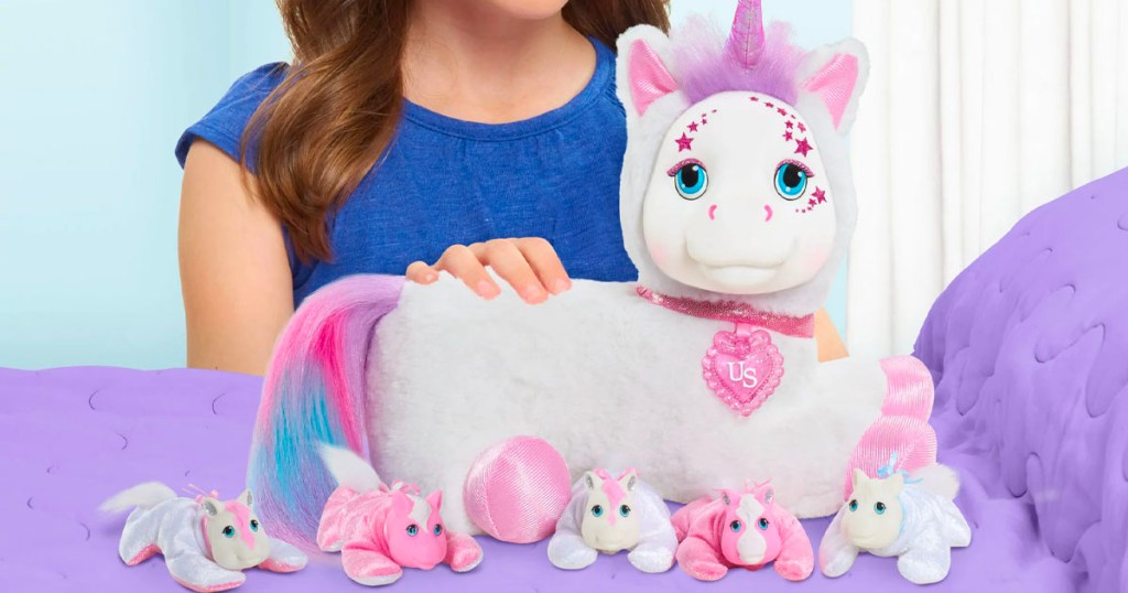 girl playing with unicorn surprise toy