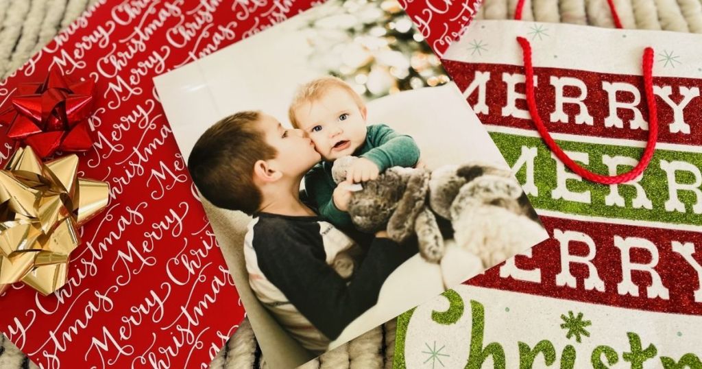8x10 photo of two kids sitting on christmas bags