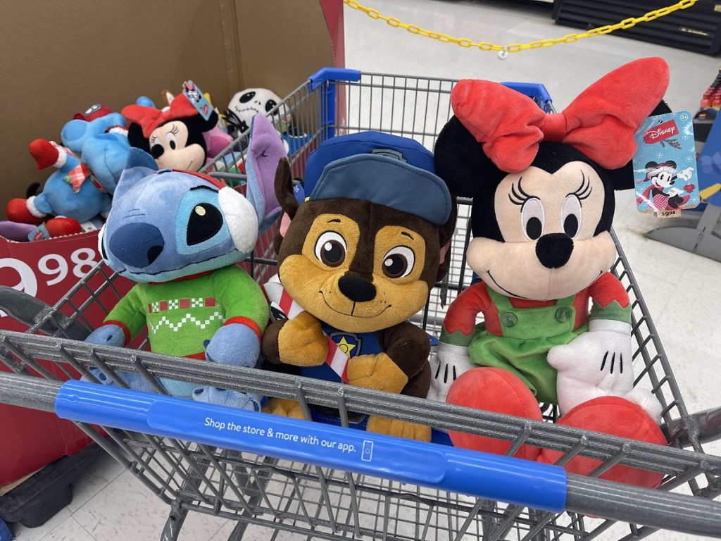 Walmart holiday plush characters in shopping cart