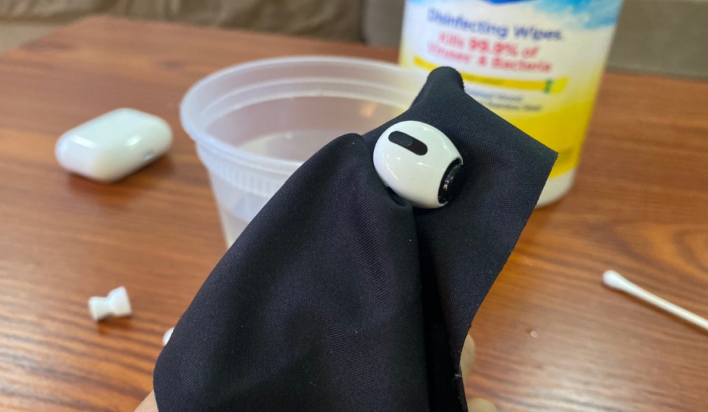 wiping airpods clean with lint free cloth