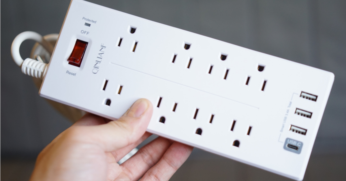 hand holding surge protector