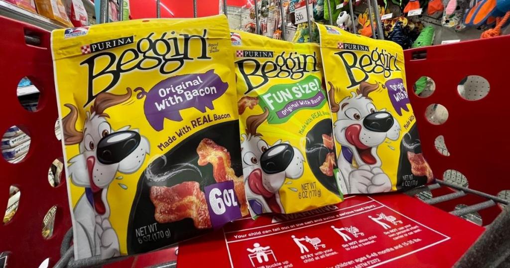 three bags of beggin' strips dog treats in shopping cart