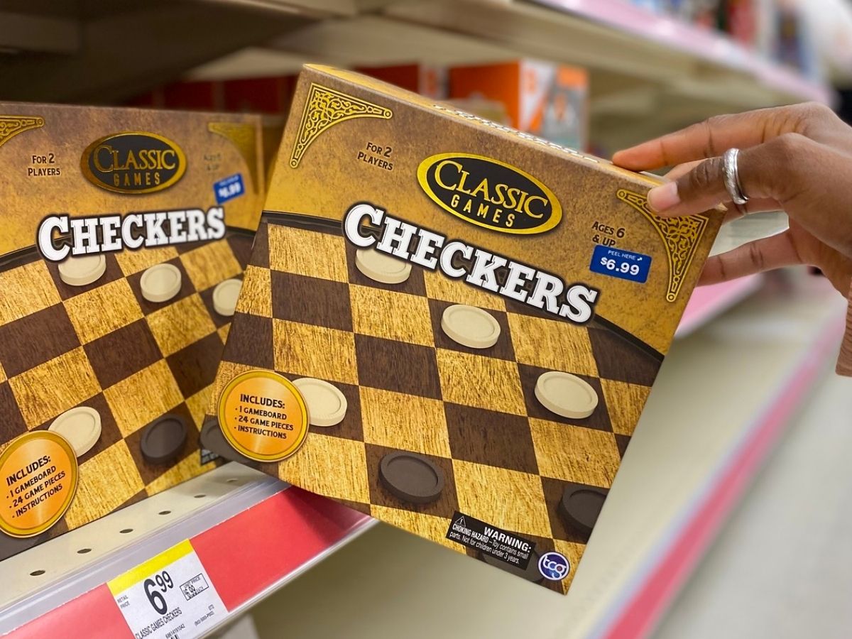 hand holding classic checkers game