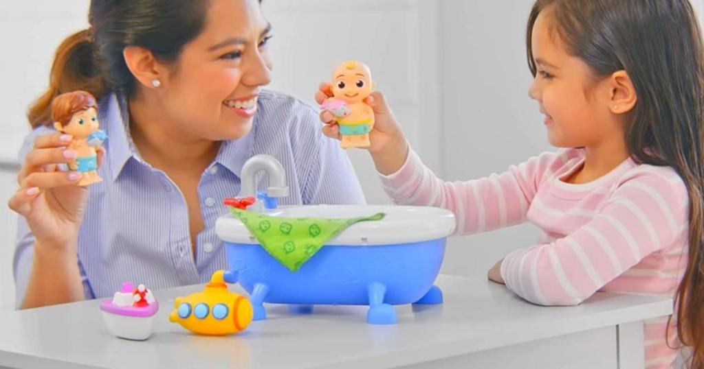 mom and daughter playing with cocomelon musical bathtime playset