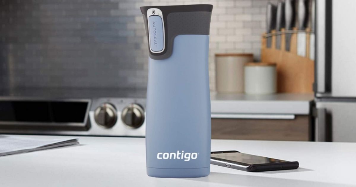 blue Contigo mug on counter next to phone