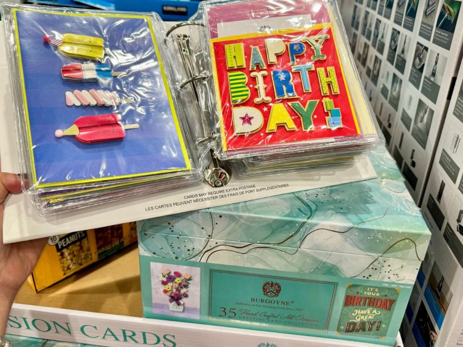 A box of Costco Greeting cards with a display of the cards inside