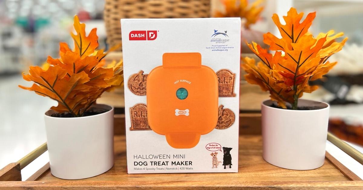 mini Halloween Dash Dog Treat Maker displayed between two planters with fall leaves